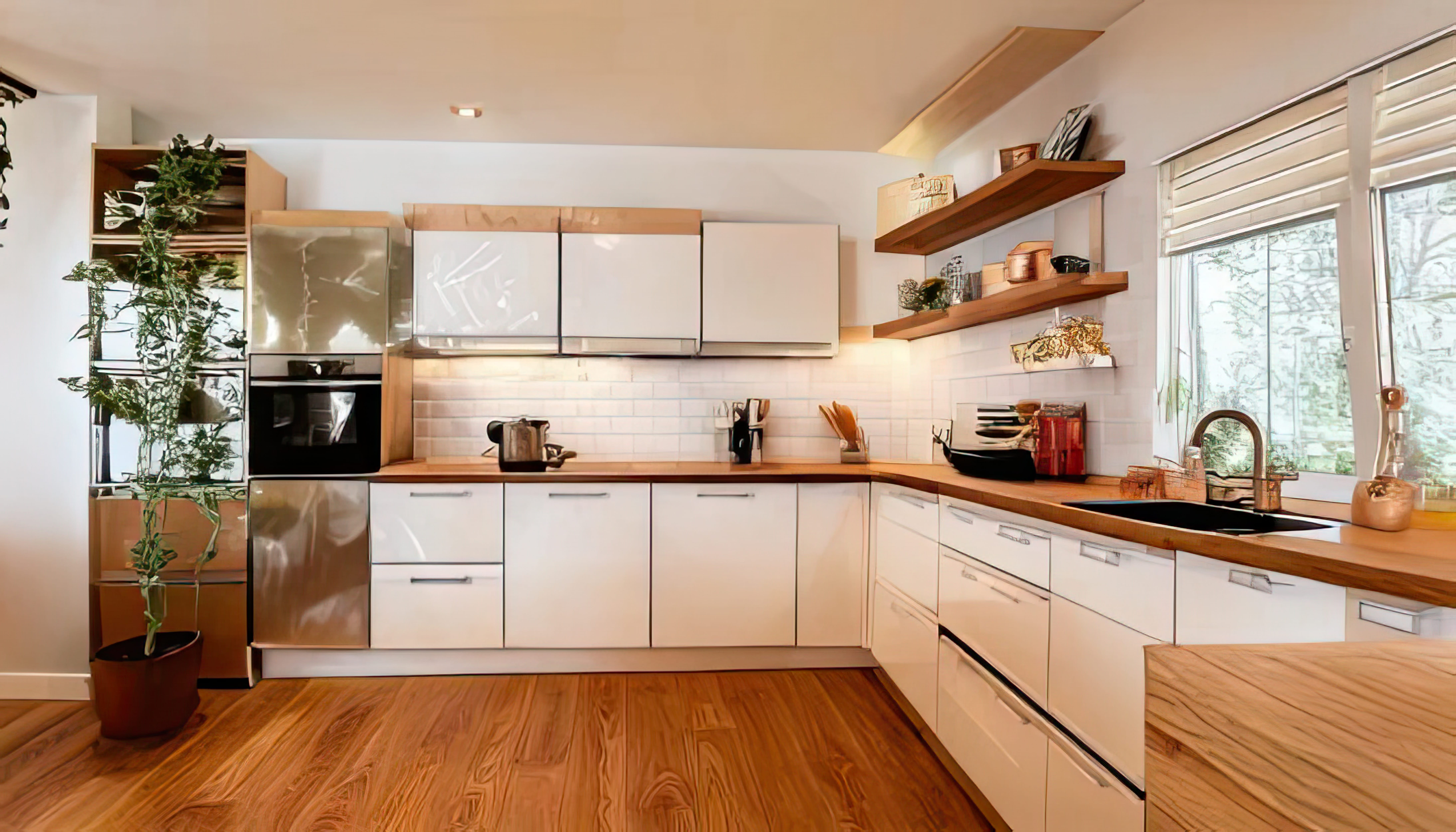 Moderne keuken met glanzende witte kastdeuren, houten werkblad en visgraat houten vloer. De achterwand is afgewerkt met witte rechthoekige wandtegels in een brick-patroon, wat zorgt voor een tijdloze, hygiënische en stijlvolle uitstraling. Perfecte combinatie van tegels en hout in de keuken.